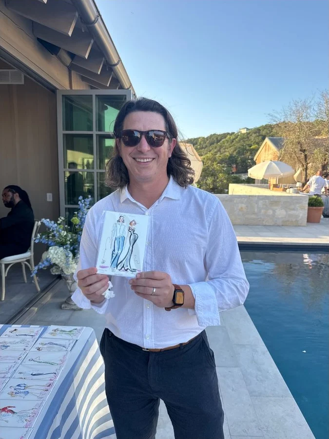 The guest holding up his sketch